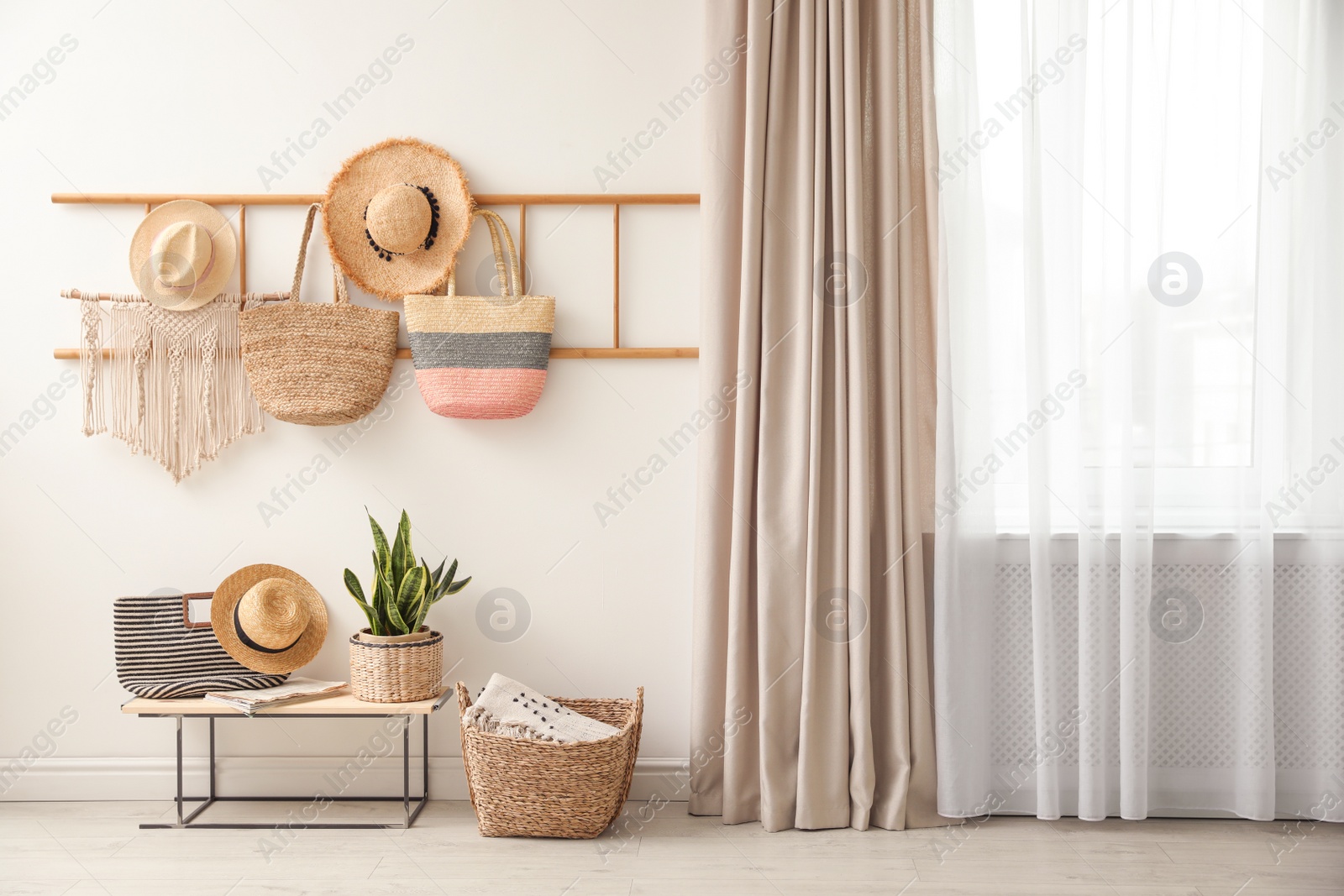 Photo of Decorative wooden ladder, bench and plant at home. Idea for interior design