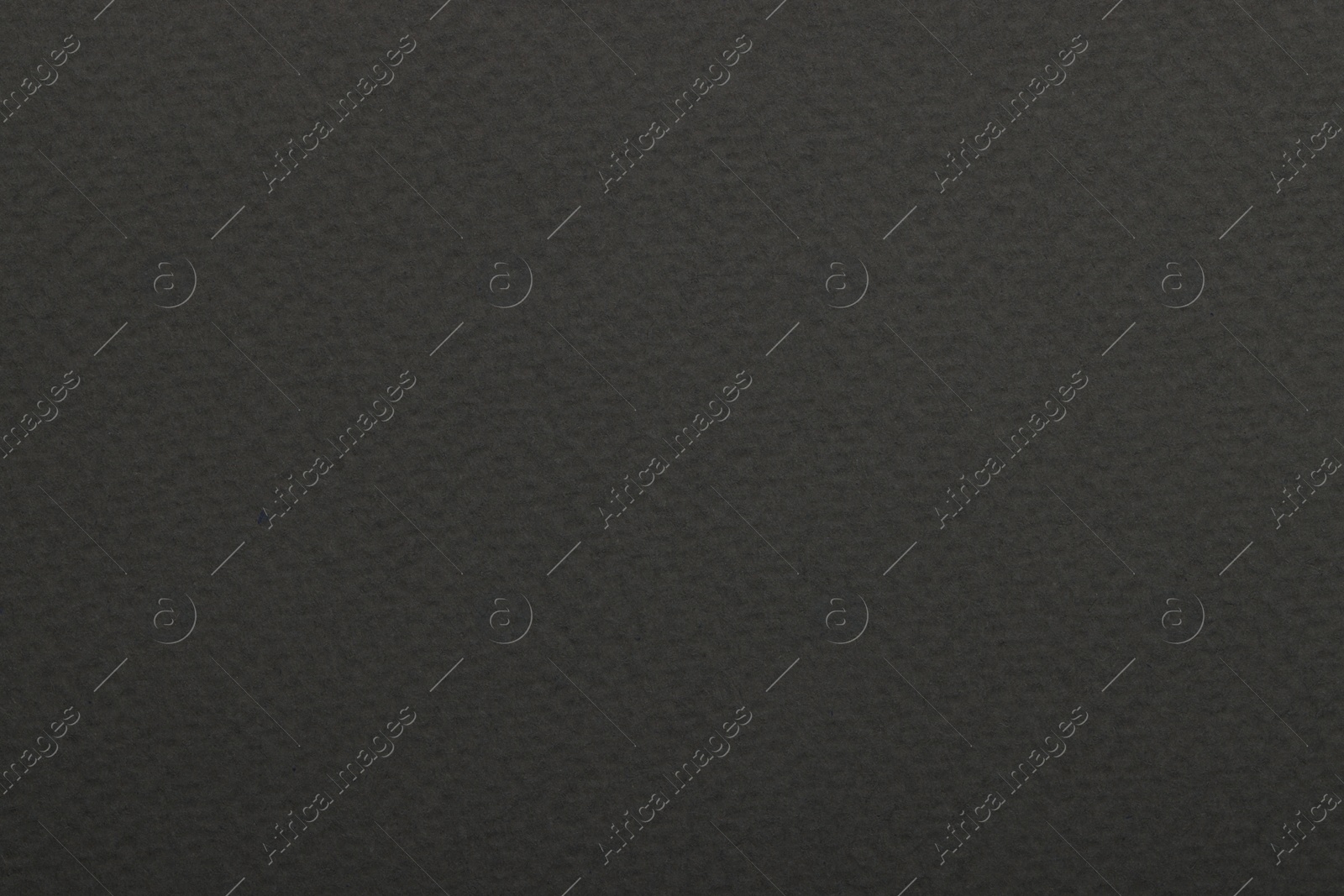 Photo of Texture of dark grey paper sheet as background, top view