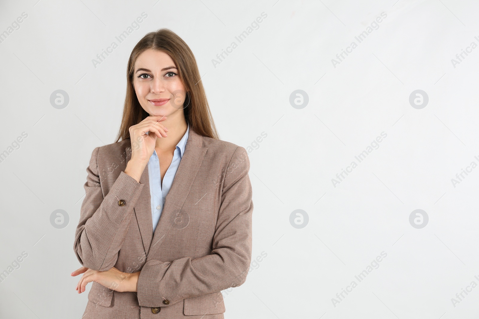 Photo of Portrait of beautiful young businesswoman on white background. Space for text
