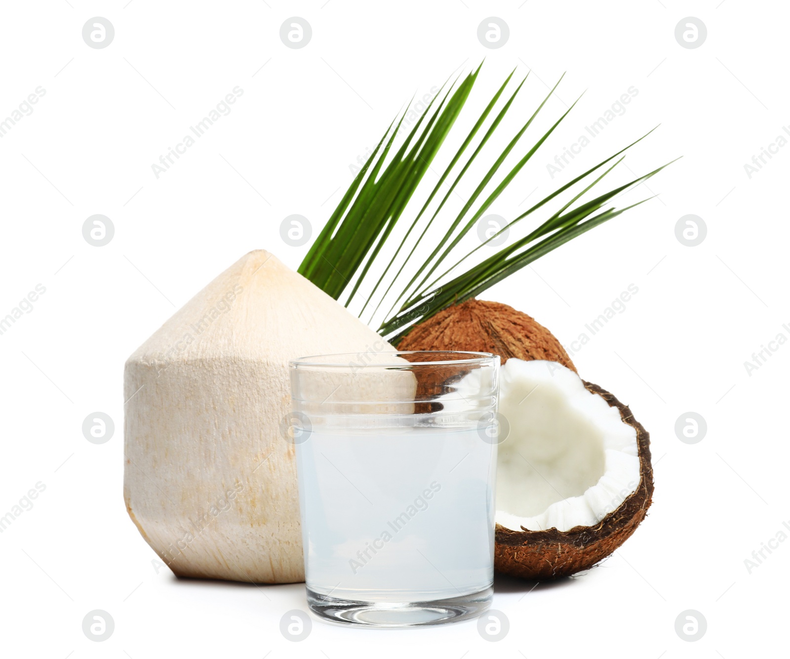 Photo of Glass of coconut milk and nuts on white background