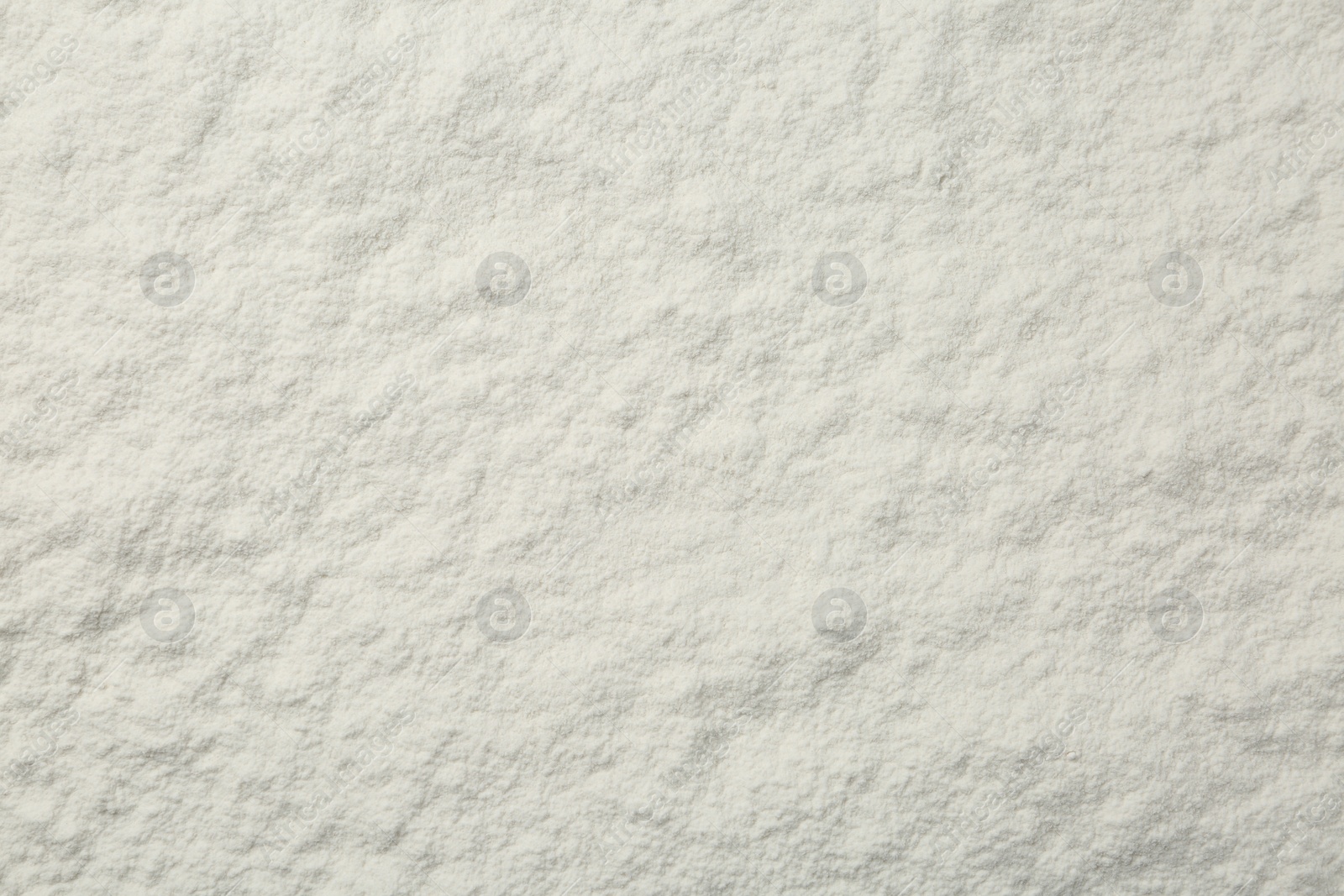 Photo of Pile of organic flour as background, top view