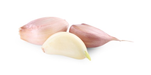Photo of Cloves of fresh garlic isolated on white