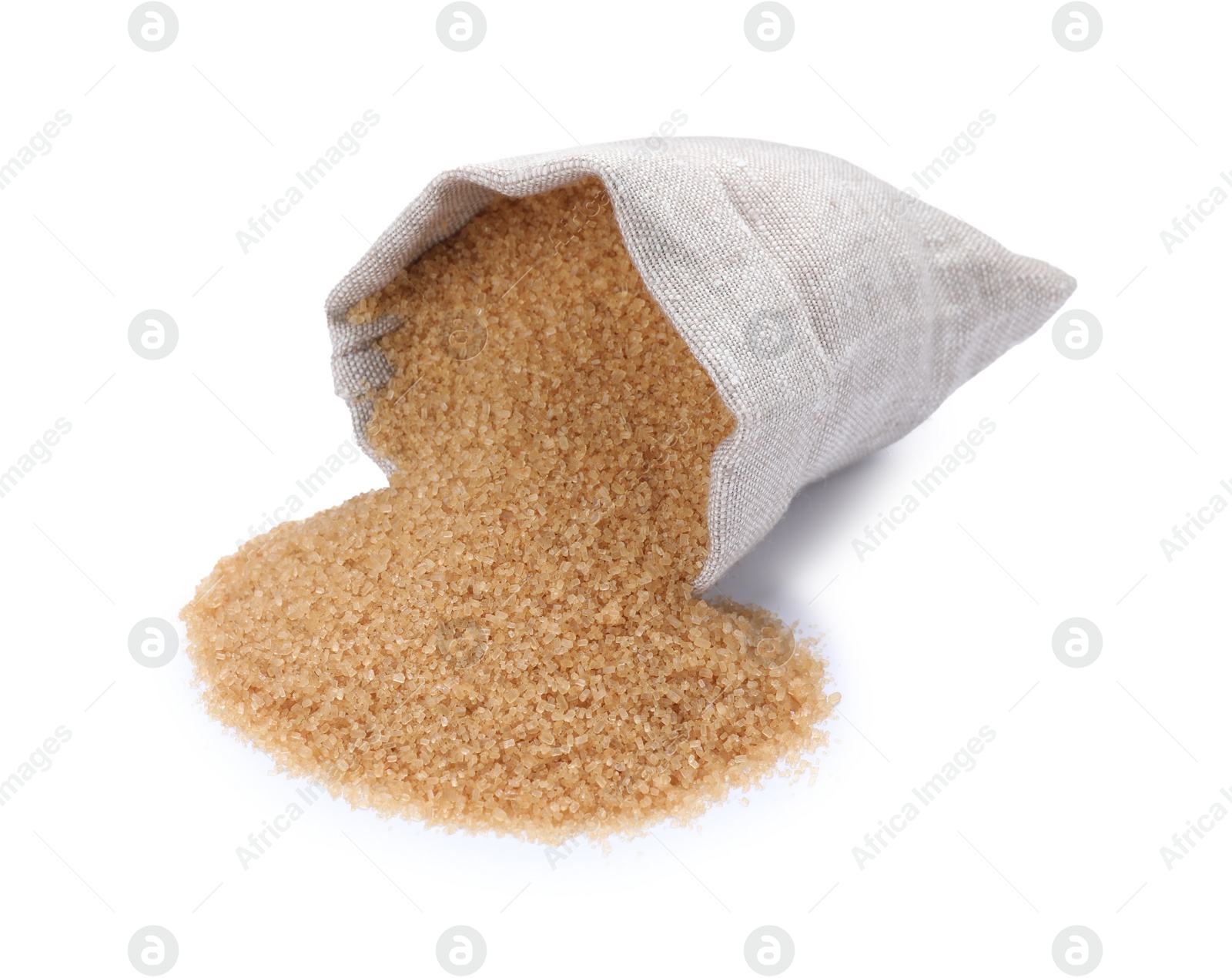 Photo of Overturned sack with brown sugar on white background