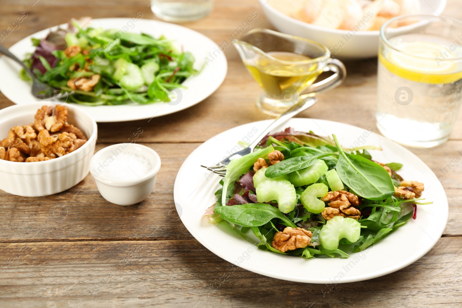 Photo of Delicious fresh celery salad on wooden table