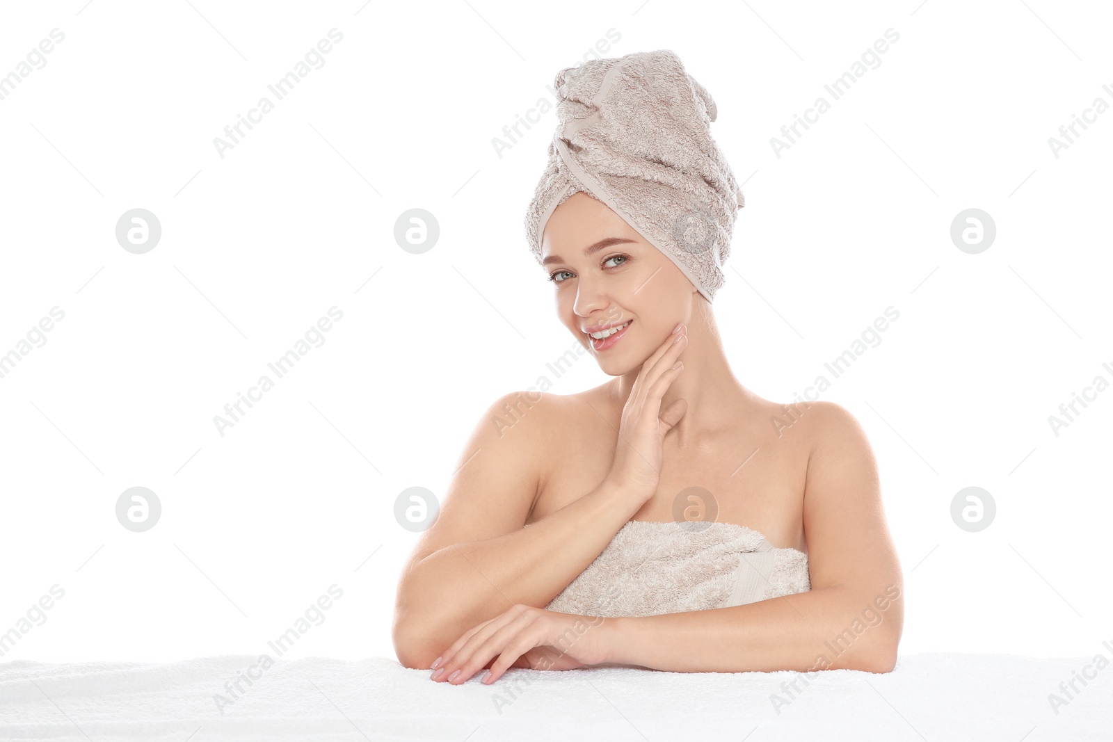 Photo of Portrait of young pretty woman with towels on white background