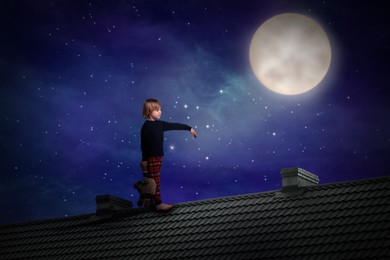 Image of Boy holding toy and sleepwalking on roof under starry sky with full moon