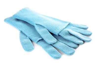 Photo of Stylish blue gloves on white background. Autumn clothes