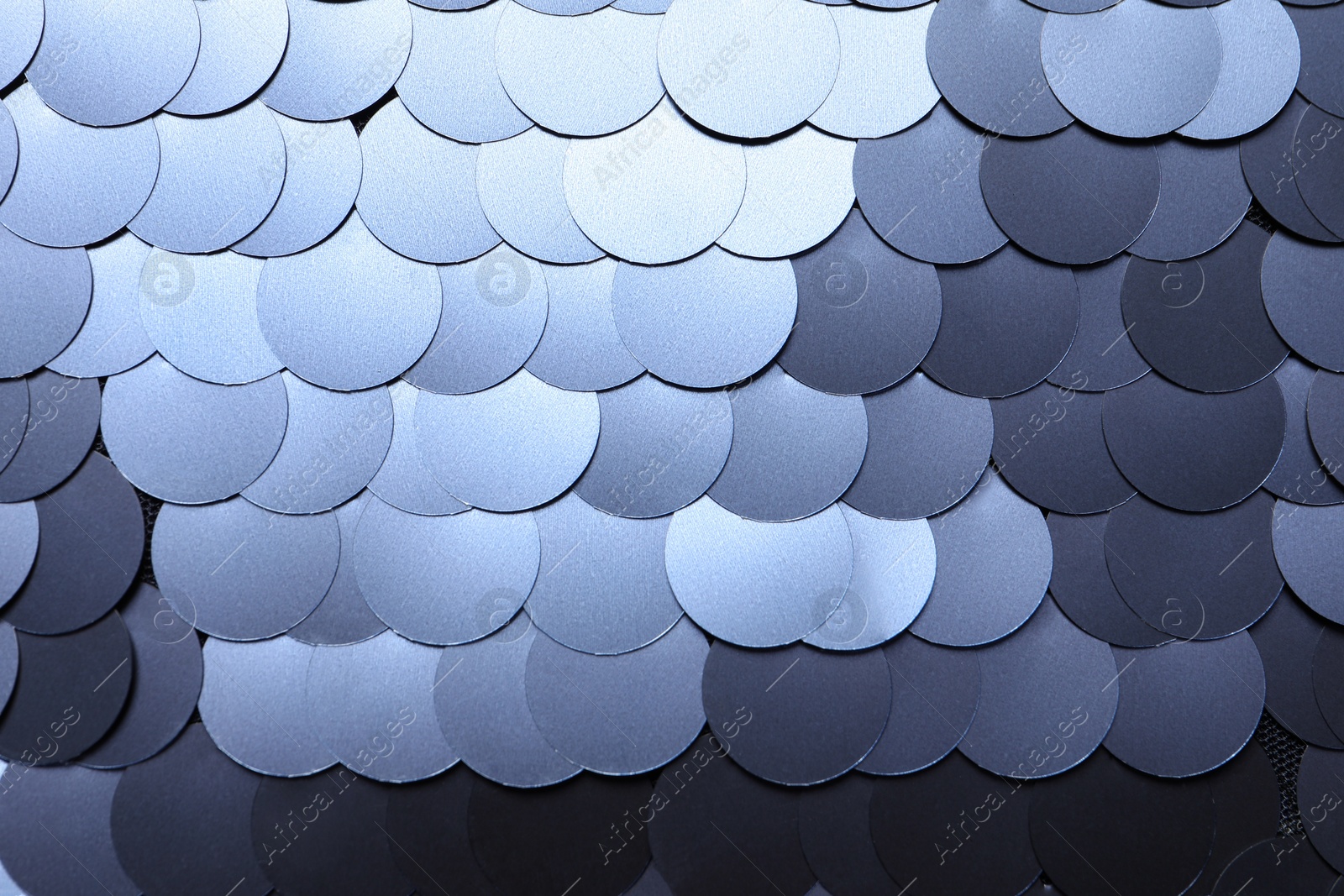 Photo of Texture of beautiful silver sequins as background, top view