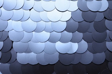 Photo of Texture of beautiful silver sequins as background, top view
