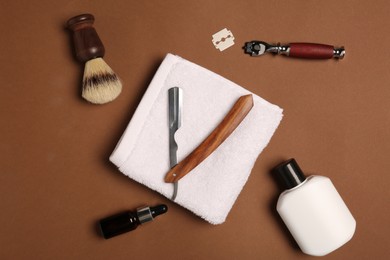Photo of Set of men's shaving tools on brown background, flat lay
