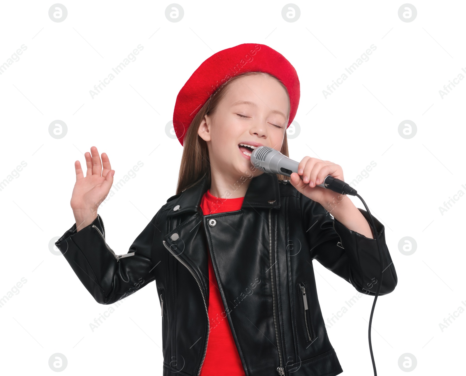 Photo of Cute little girl with microphone singing on white background