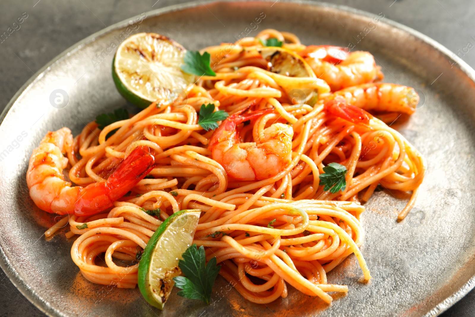 Photo of Delicious pasta with shrimps on plate