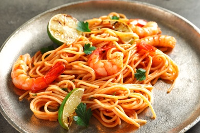 Photo of Delicious pasta with shrimps on plate