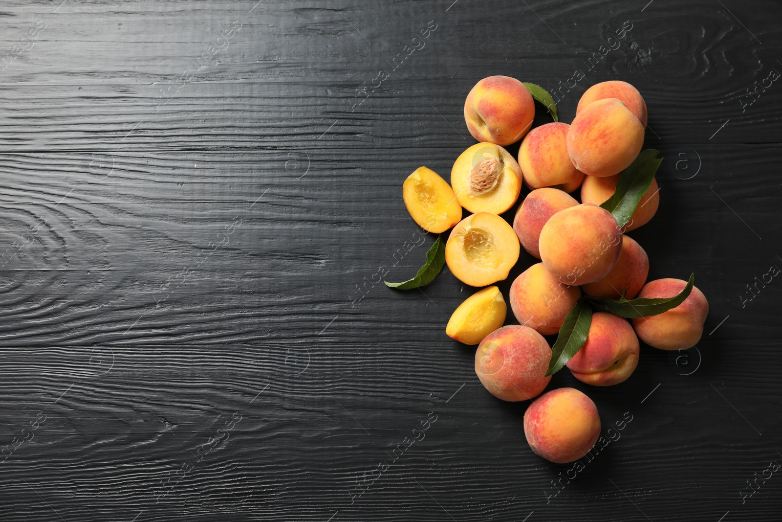 Photo of Flat lay composition with ripe peaches on wooden background