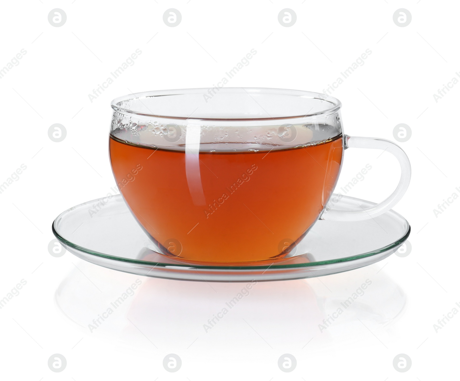 Photo of Aromatic tea in glass cup isolated on white