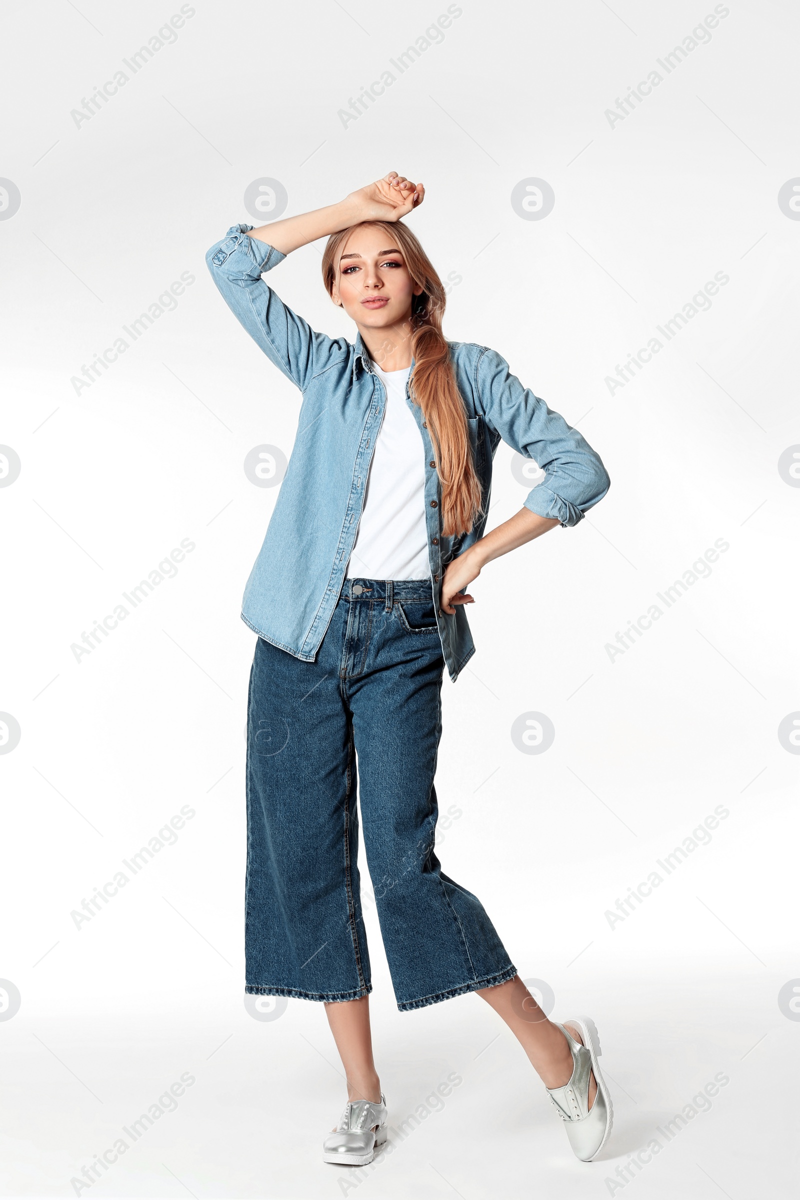 Photo of Full length portrait of woman in stylish shoes on white background