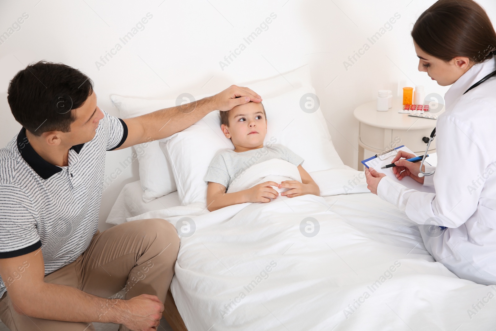 Photo of Children's doctor visiting little patient at home