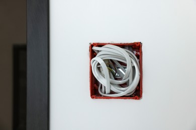 Mounting box with wires on wall, closeup