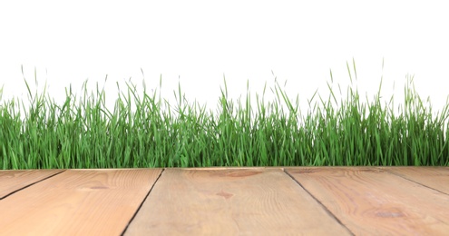 Wooden deck and green grass isolated on white