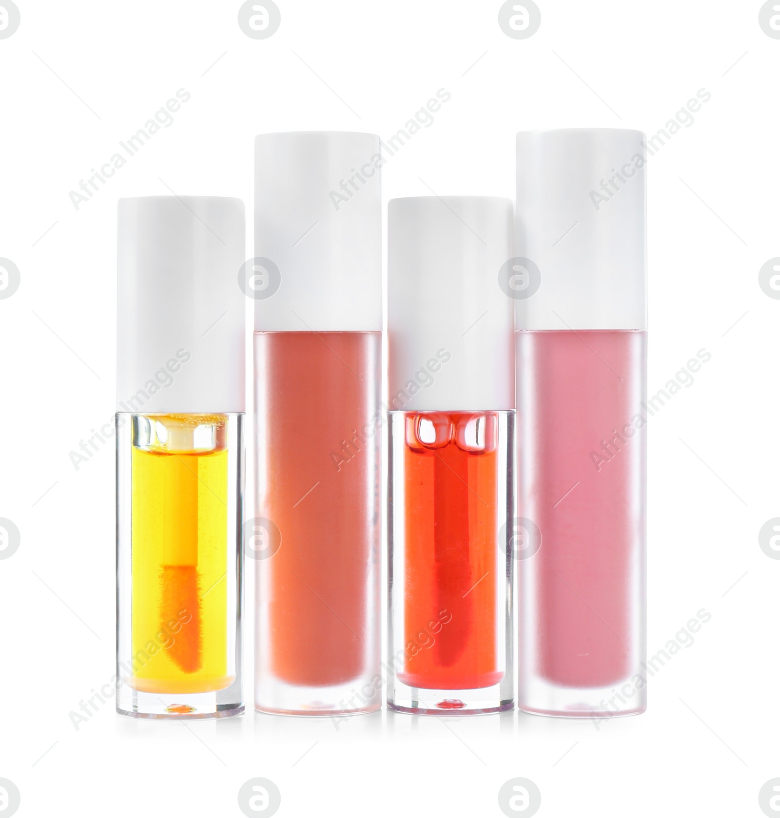 Photo of Many different lip glosses isolated on white