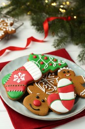 Tasty homemade Christmas cookies on white table