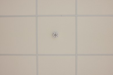 Photo of White ceiling with PVC tiles, view from below