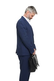 Photo of Mature businessman with briefcase posing on white background