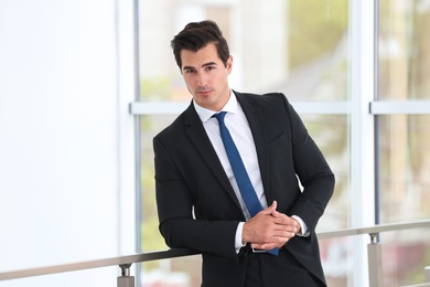 Handsome young man in stylish suit indoors