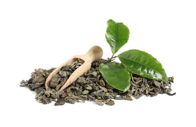 Fresh and dry leaves of tea plant with wooden scoop on white background