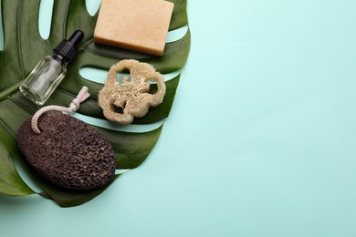Photo of Flat lay composition with pumice stone on turquoise background. Space for text