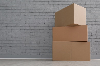 Photo of Cardboard boxes on floor indoors