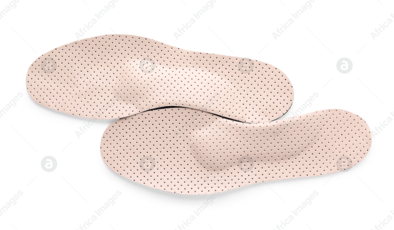 Photo of Beige orthopedic insoles isolated on white, top view