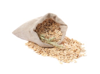 Photo of Overturned sack with oatmeal and florets isolated on white
