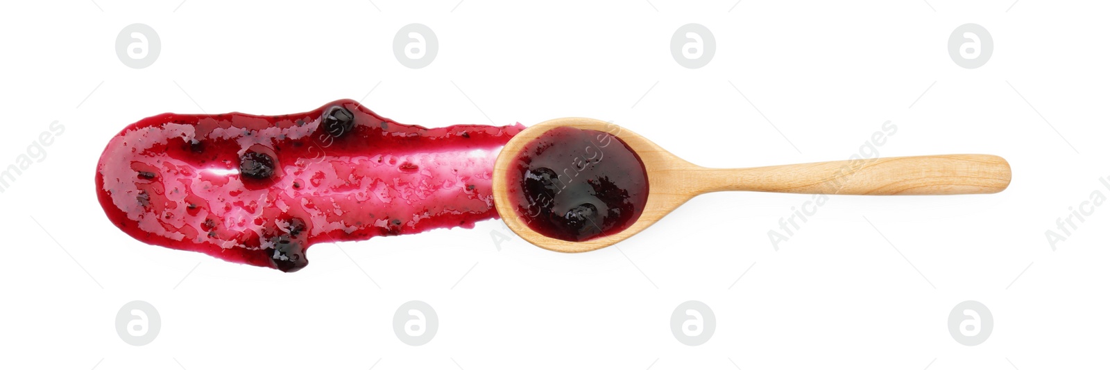 Photo of Tasty sweet jam and spoon isolated on white, top view