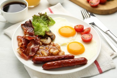 Photo of Delicious breakfast with sunny side up eggs served on white table, closeup