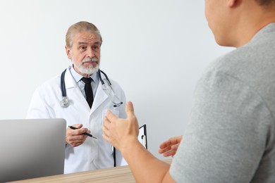 Patient having appointment with doctor in clinic