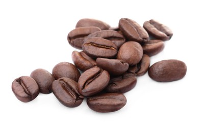 Photo of Many aromatic roasted coffee beans isolated on white