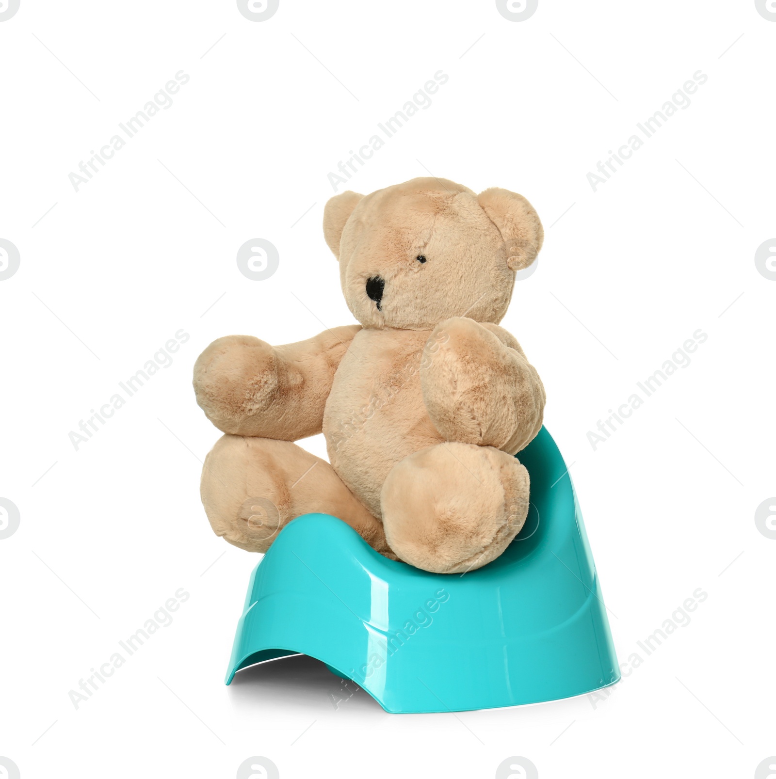Photo of Teddy bear sitting on blue potty against white background. Toilet training