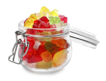 Glass jar with delicious jelly bears on white background