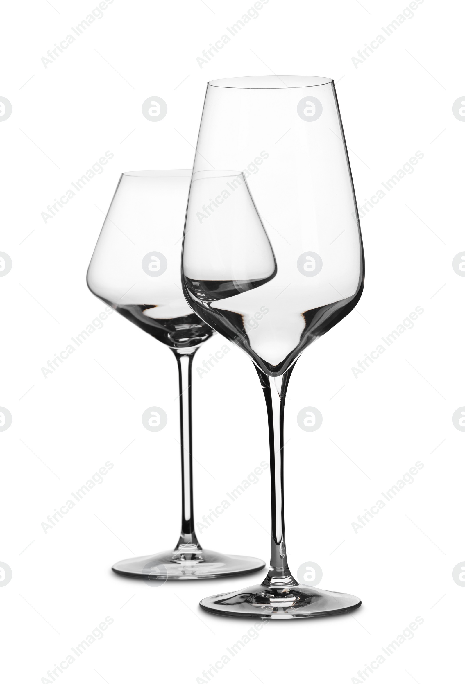 Photo of Two stylish clean glasses isolated on white