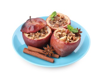 Tasty baked apples with nuts, honey, spices and mint isolated on white