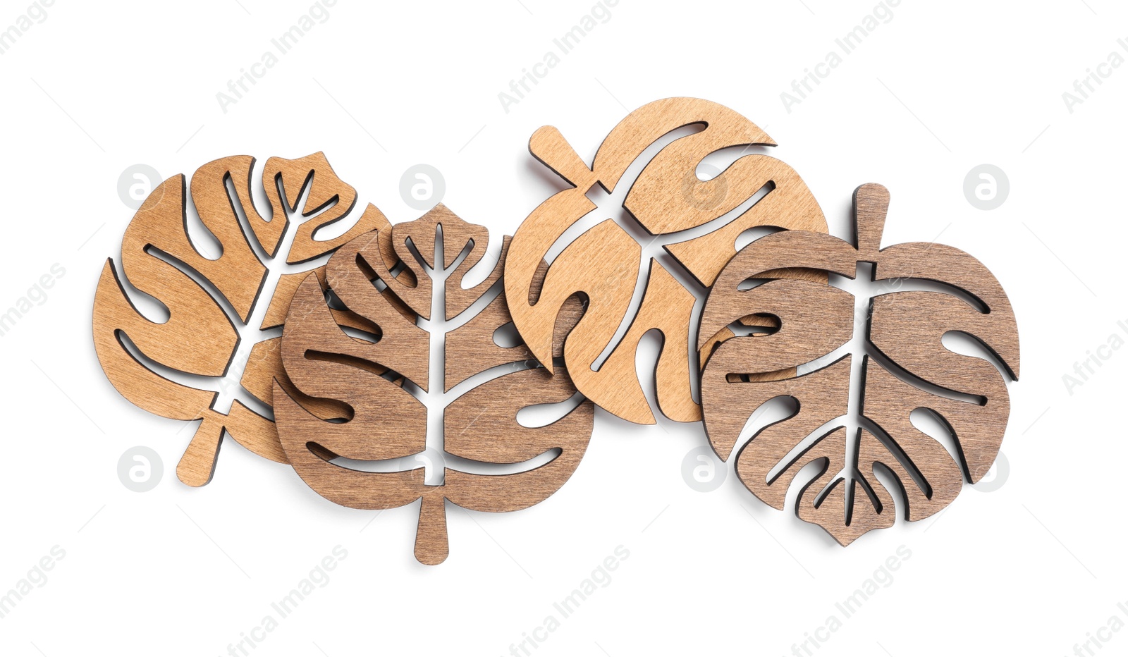 Photo of Leaf shaped wooden cup coasters on white background, top view