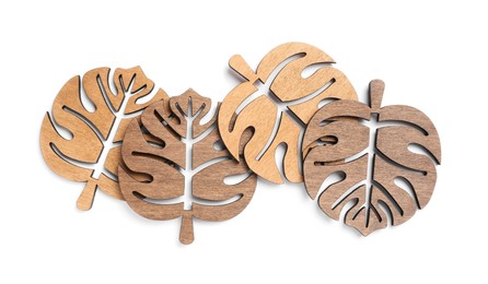 Leaf shaped wooden cup coasters on white background, top view