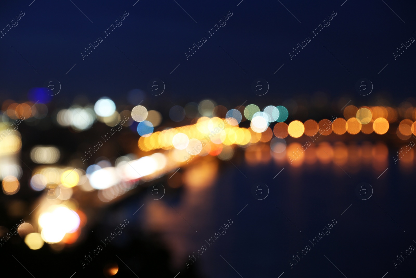 Photo of Blurred view of beautiful city at night. Bokeh effect