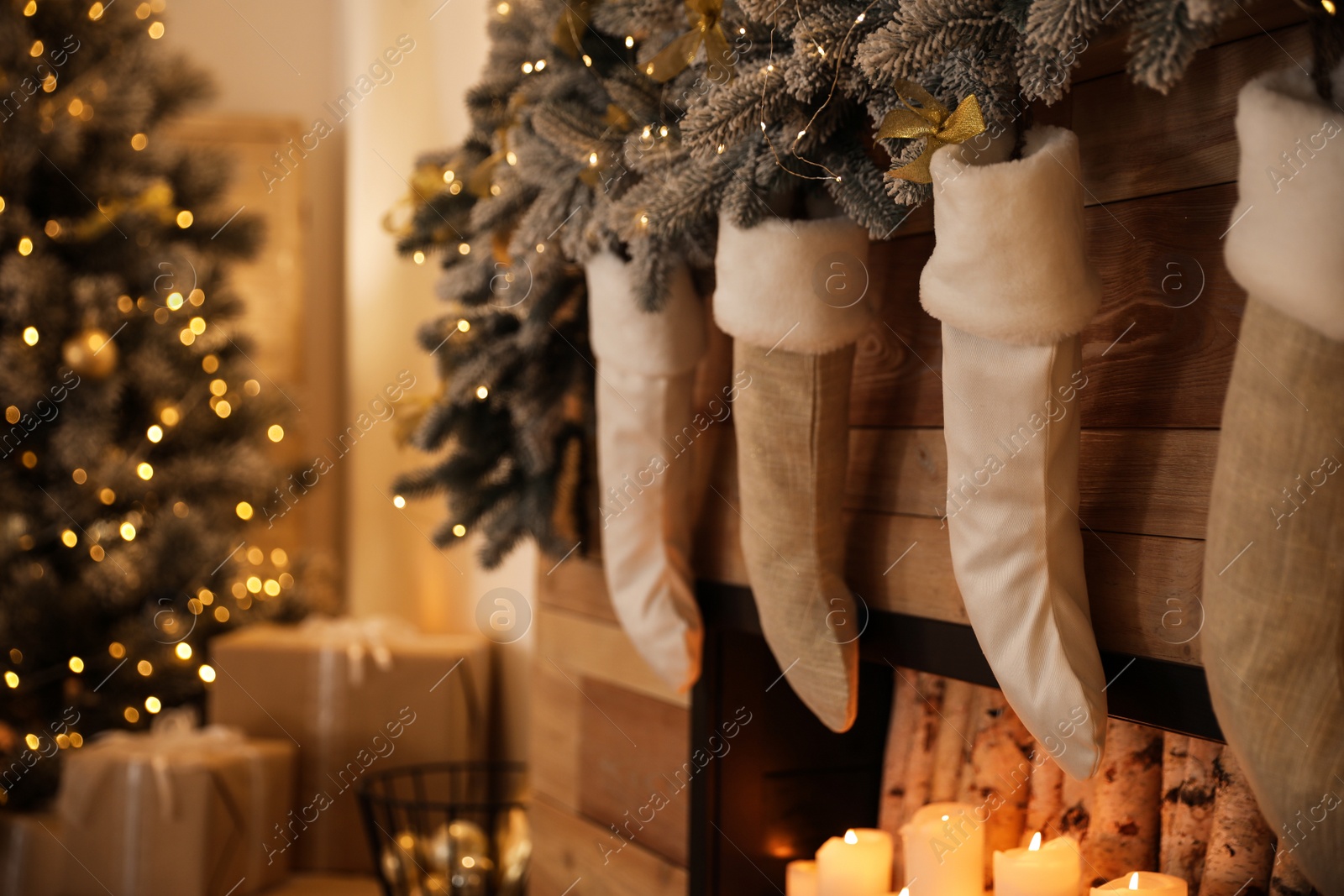 Photo of Stylish room interior with decorative fireplace. Christmas time