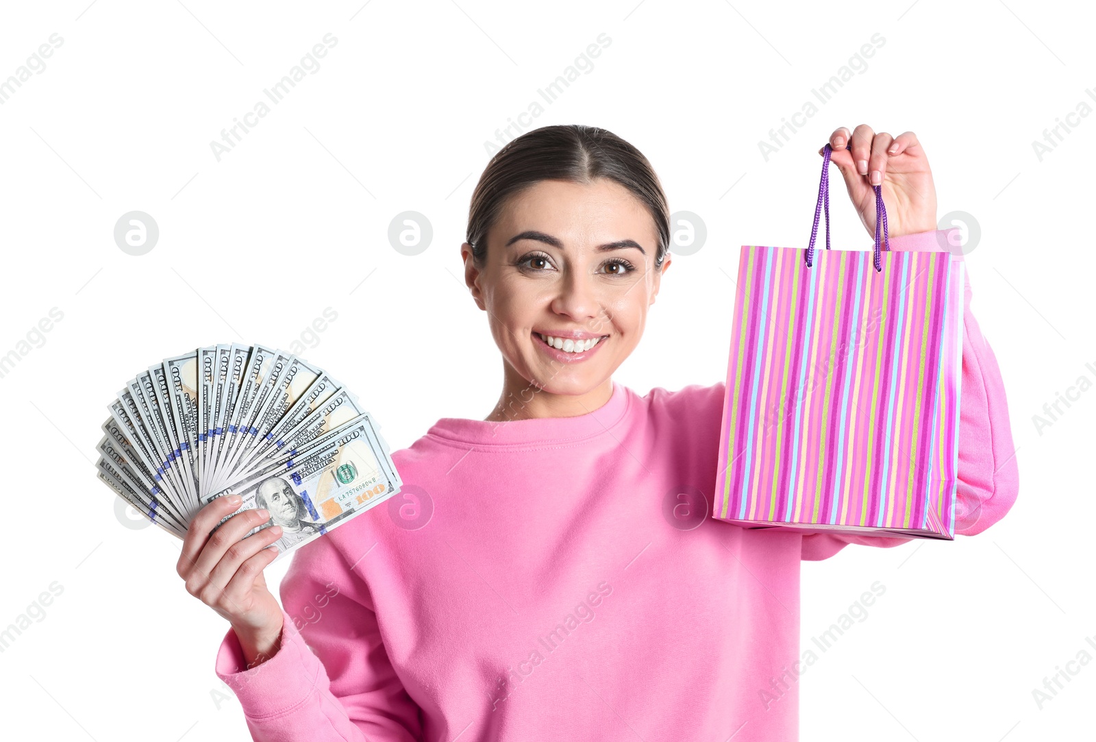 Photo of Portrait of young woman holding money banknotes and shopping bag on white background