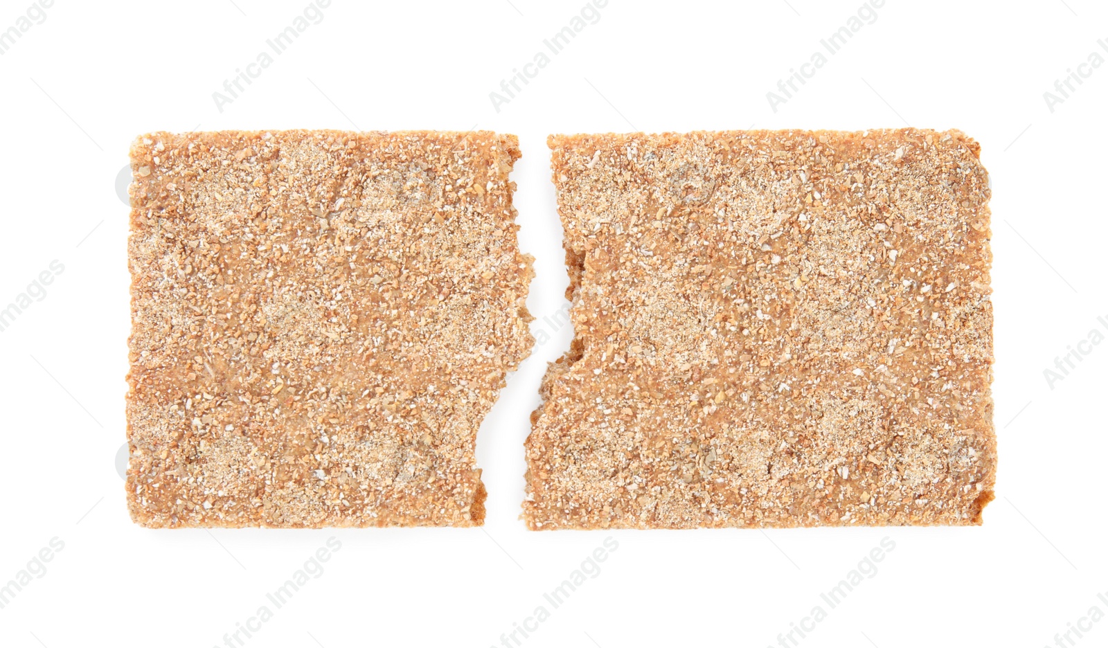 Photo of Halves of crunchy rye crispbread on white background, top view