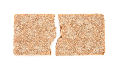Photo of Halves of crunchy rye crispbread on white background, top view