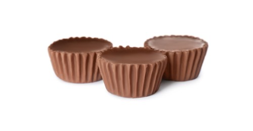 Photo of Sweet peanut butter cups isolated on white