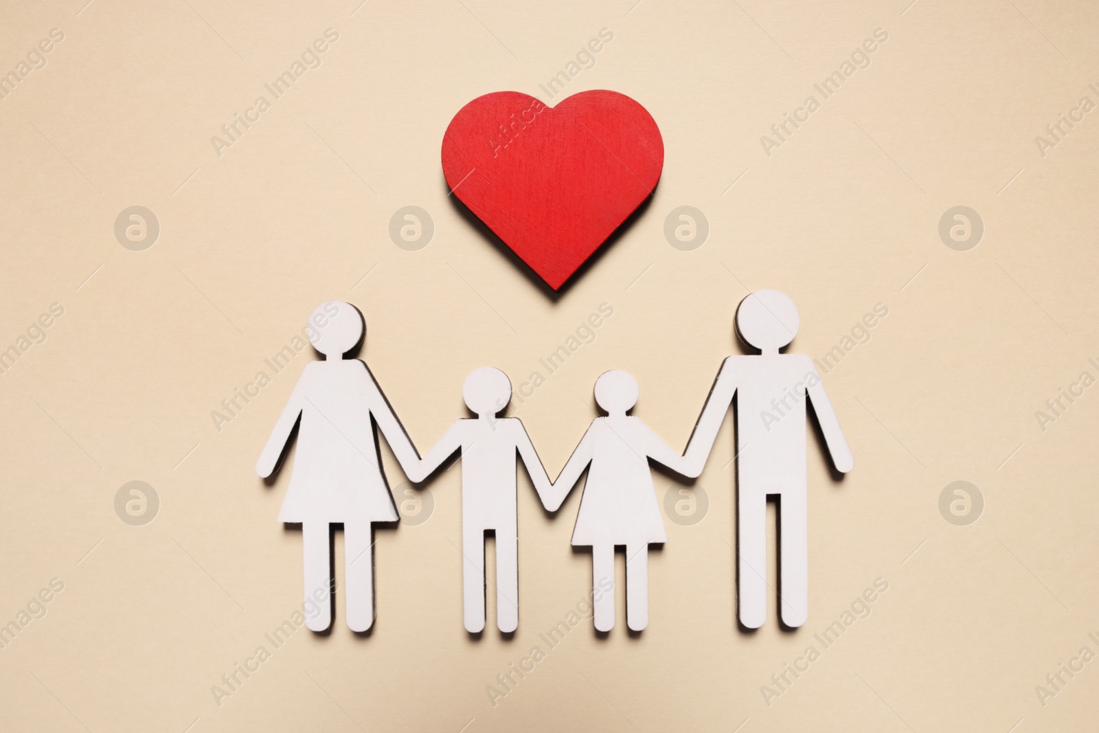 Photo of Figures of family and heart on beige background, top view. Insurance concept